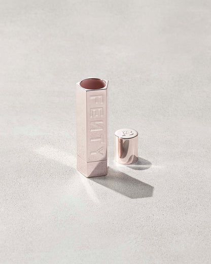 An open Fenty Icon refillable lipstick holder in metallic.