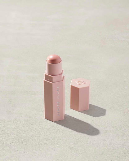 Match Stix Corrector Skinstick shown in shade Rose Quartz with open packaging on a concrete background.